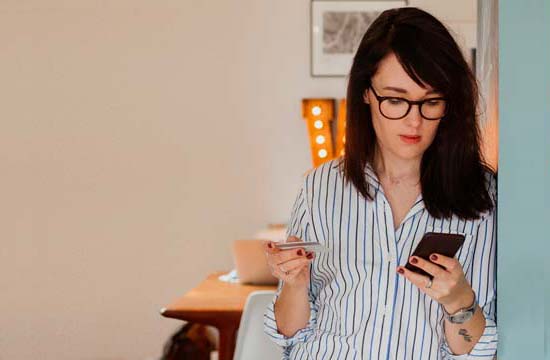 a woman with a credit card in her hand