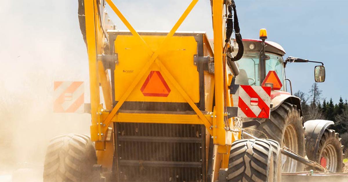 Agricultural worker driving a truck