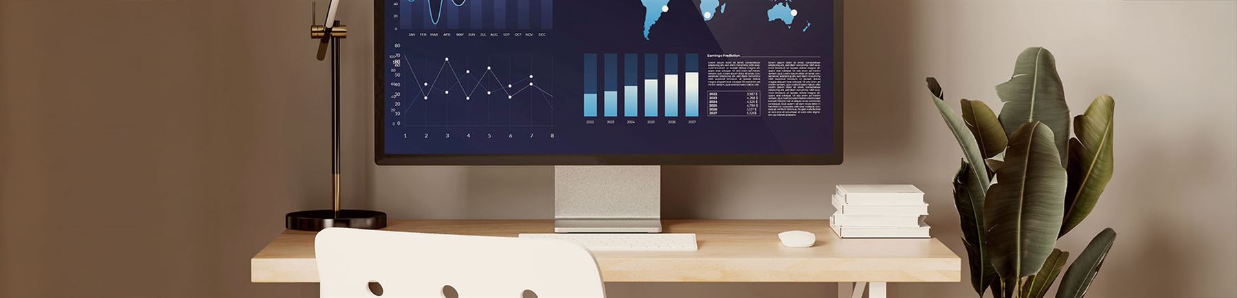 Datorskärm som visar grafer på skrivbord.