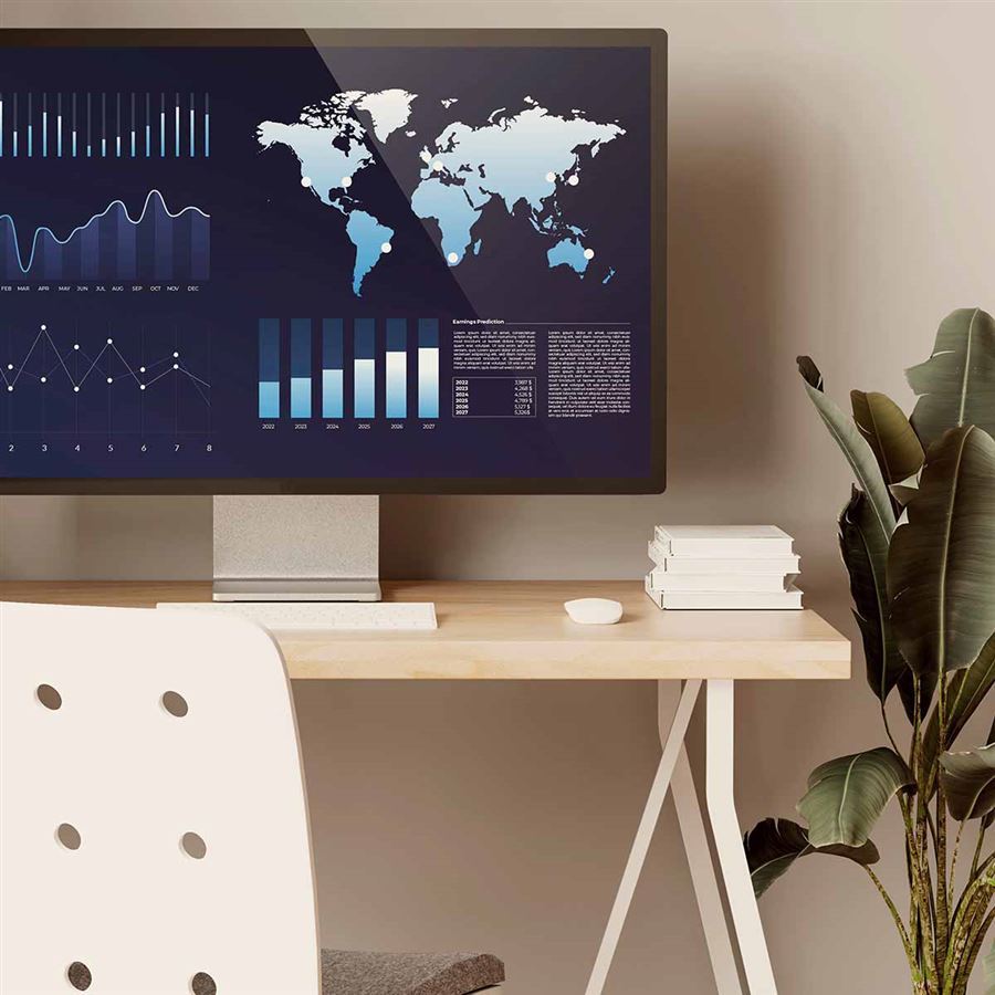 Datorskärm som visar grafer på skrivbord.