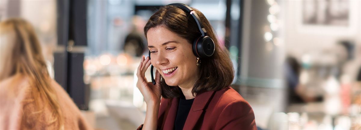 Woman in an office answering support questions. 