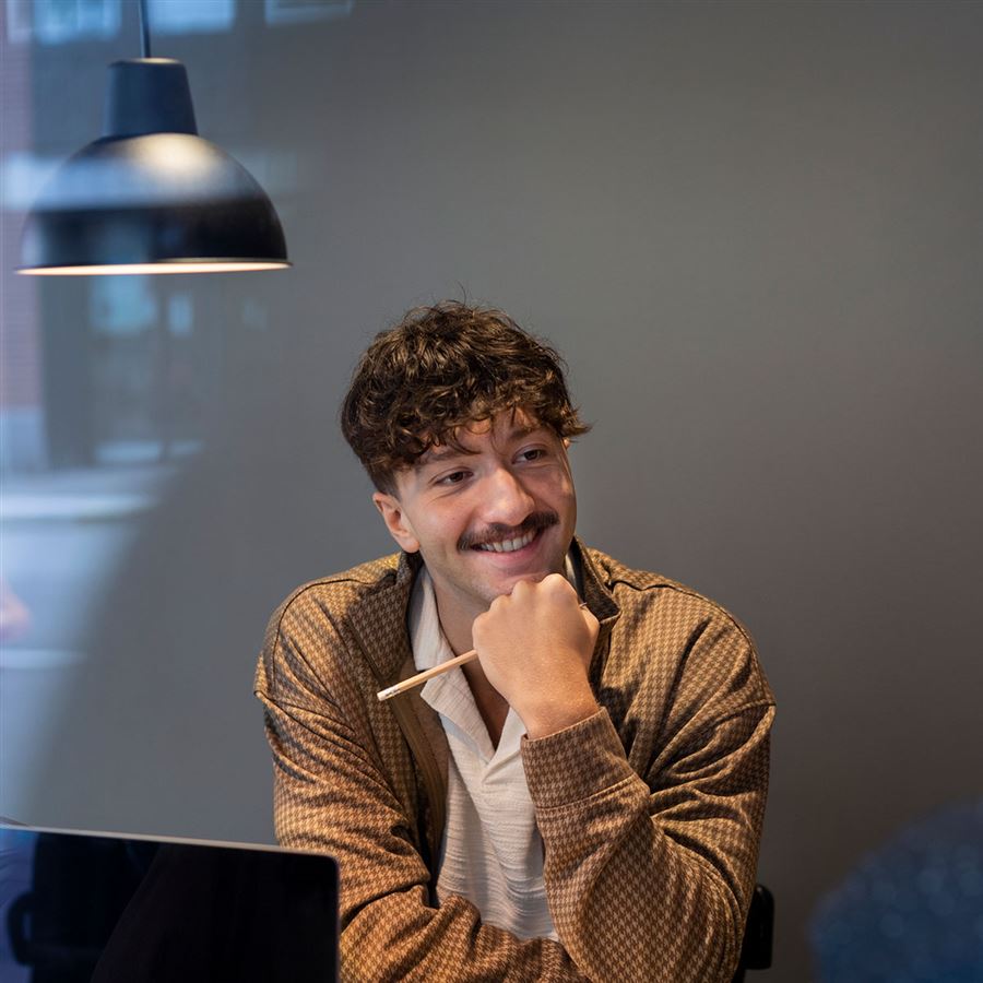 Man pondering at the office.