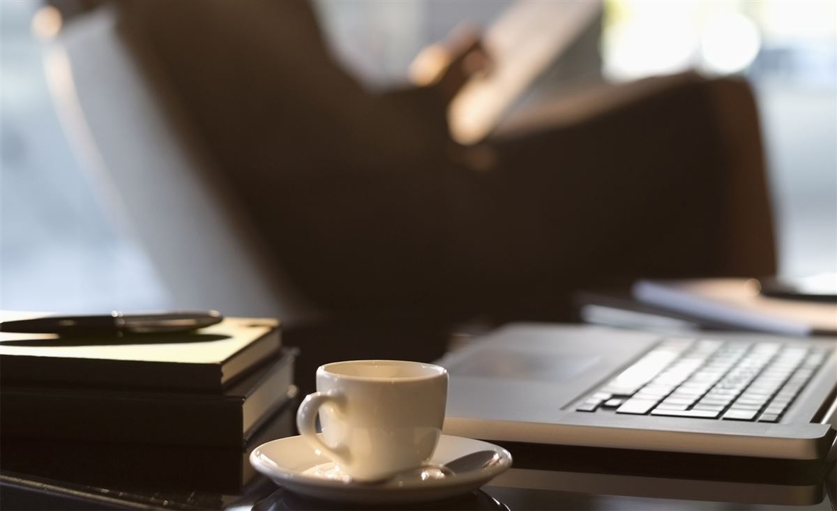 Computer and yellow cup