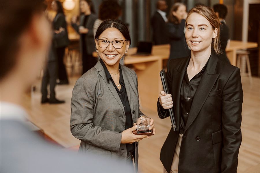 Two smiling business colleagues.