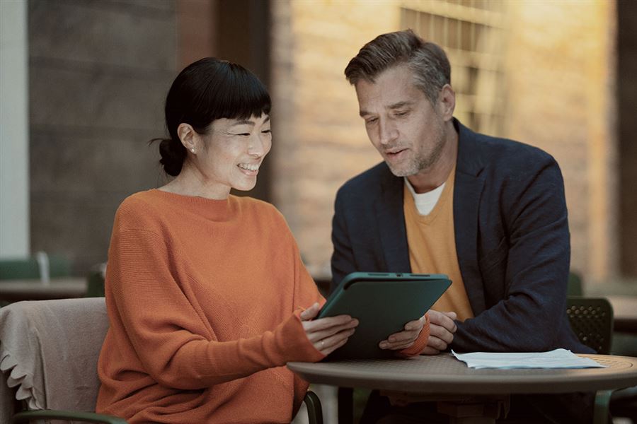 colleagues checking tablet